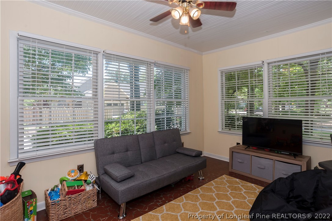 1904 Morganton Road Fayetteville, NC 28305 - Photo 15 of 45 a living room with furniture a flat screen tv and a large window