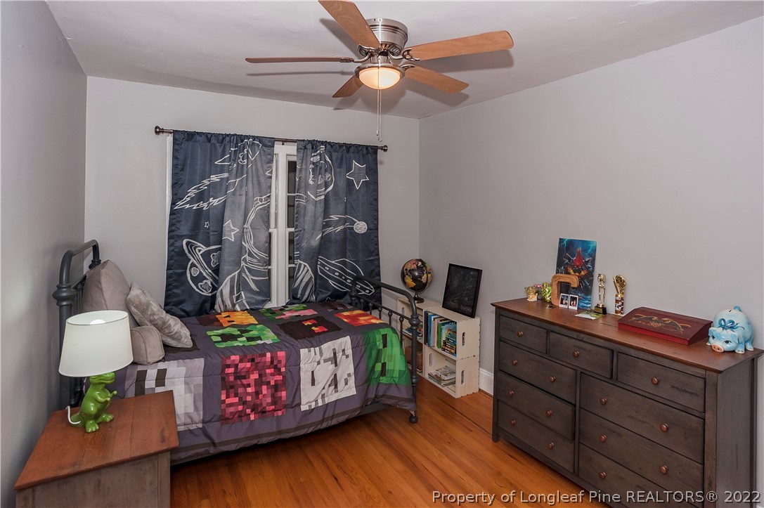 1904 Morganton Road Fayetteville, NC 28305 - Photo 29 of 45 a bedroom with furniture and a bed