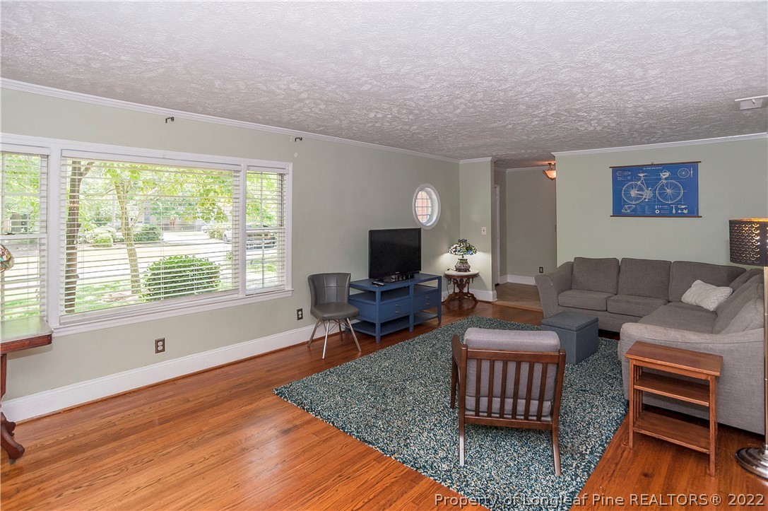 1904 Morganton Road Fayetteville, NC 28305 - Photo 36 of 45 a living room with furniture wooden floor and a flat screen tv