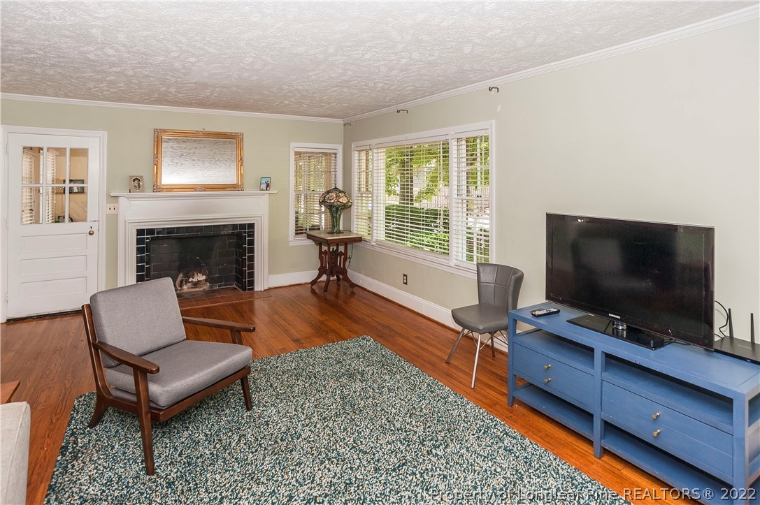 1904 Morganton Road Fayetteville, NC 28305 - Photo 39 of 45 a living room with furniture and a fireplace