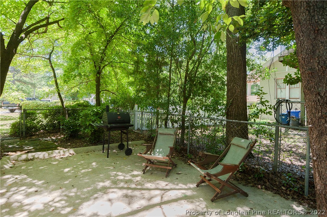 1904 Morganton Road Fayetteville, NC 28305 - Photo 6 of 45 a view of a backyard with chairs and a table
