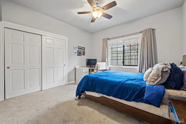 a living room with kitchen island furniture and a chandelier