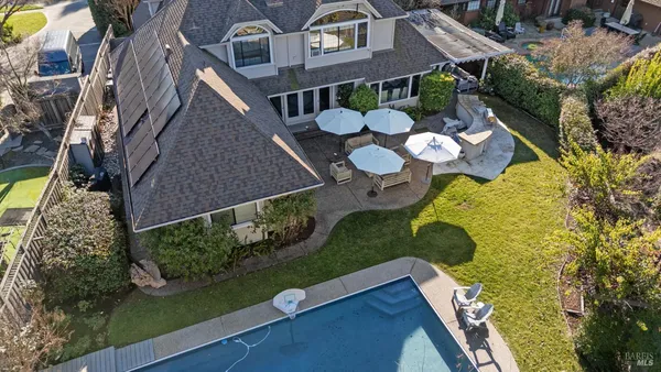 an aerial view of house with yard