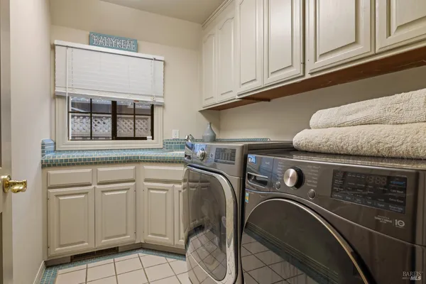 a spacious bedroom with a bed and a large window