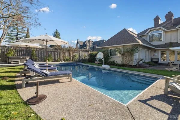 a table and chairs in the garden