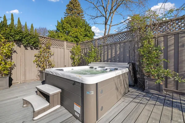 a view of a patio with table and chairs potted plants with wooden floor