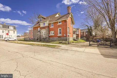 a view of a building with a street