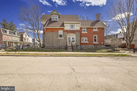 a front view of residential houses with yard