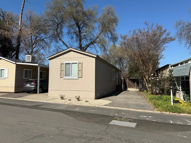 a kitchen with a stove sink and a refrigerator
