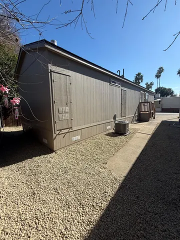 a kitchen with a sink a stove a refrigerator a oven and a refrigerator