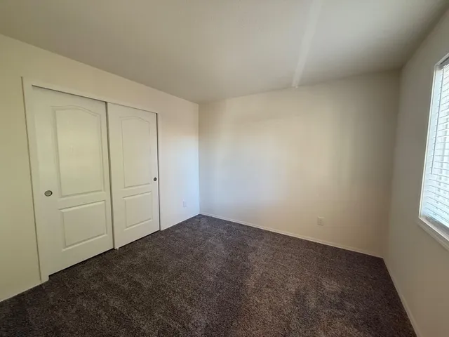 a view of a balcony with wooden floor and stairs