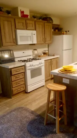 a view of a pathway of a house with wooden stairs