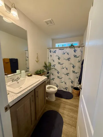 a view of a street with cars on city street