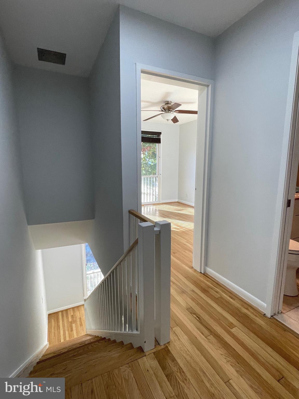 108 G Street Southwest, Unit 105 Washington, DC 20024 - Photo 17 of 52 a view of an empty room with wooden floor and a window