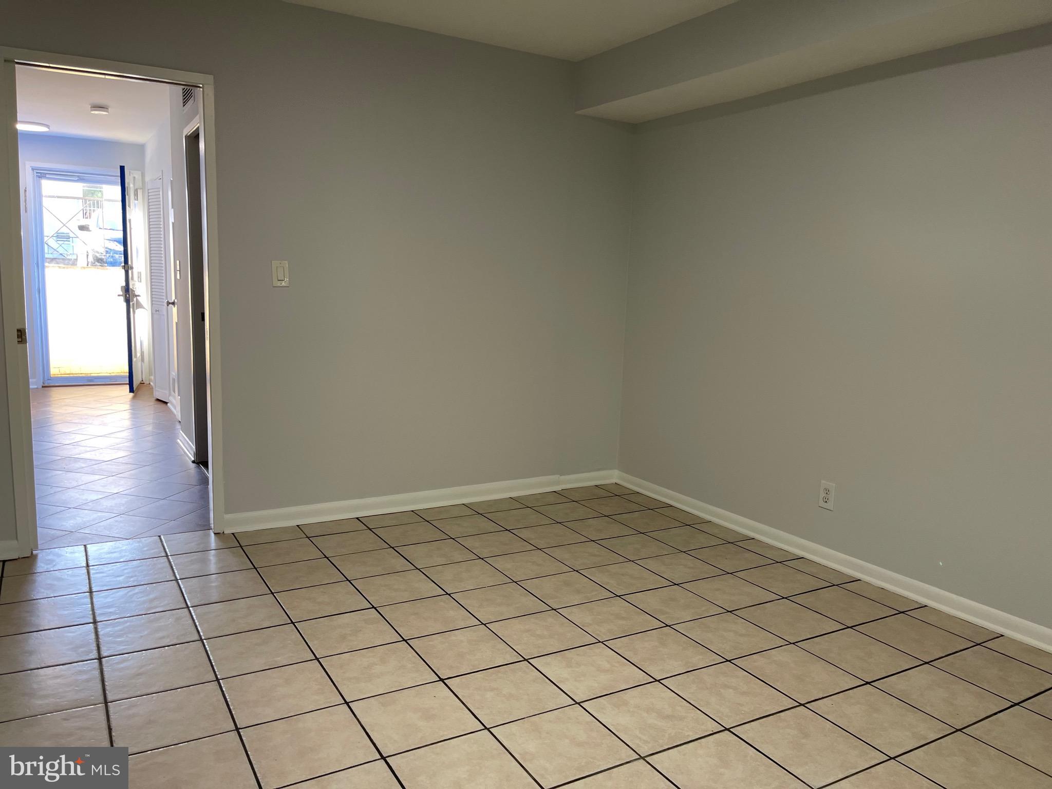 108 G Street Southwest, Unit 105 Washington, DC 20024 - Photo 37 of 52 a view of an empty room and wooden floor