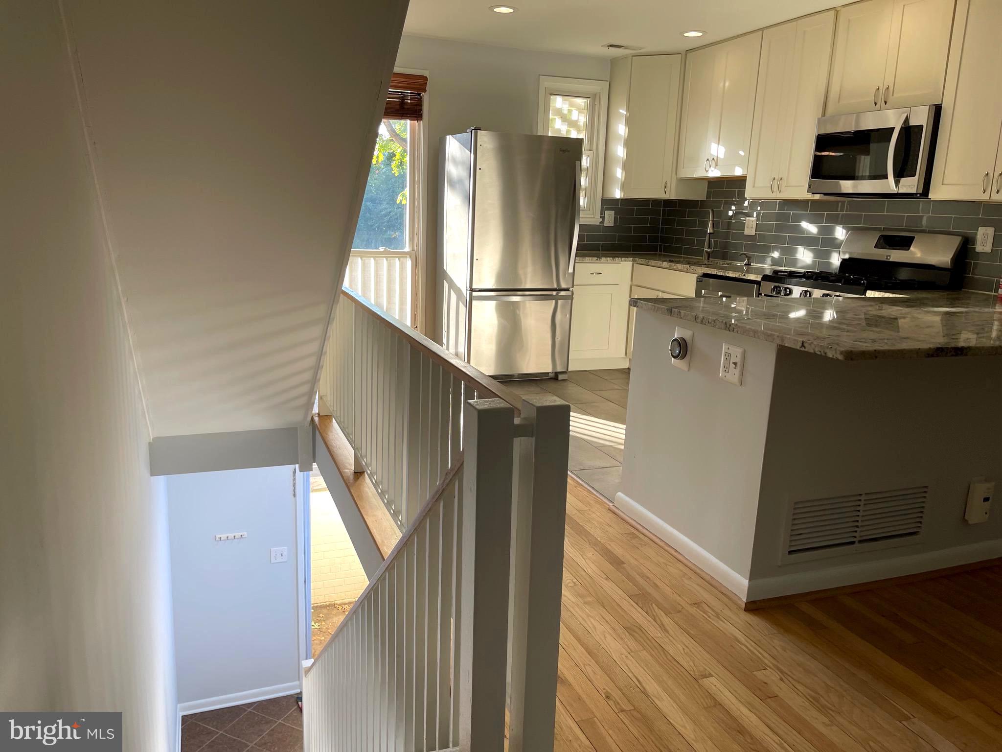 108 G Street Southwest, Unit 105 Washington, DC 20024 - Photo 6 of 52 a kitchen with stainless steel appliances granite countertop a refrigerator a stove and a sink