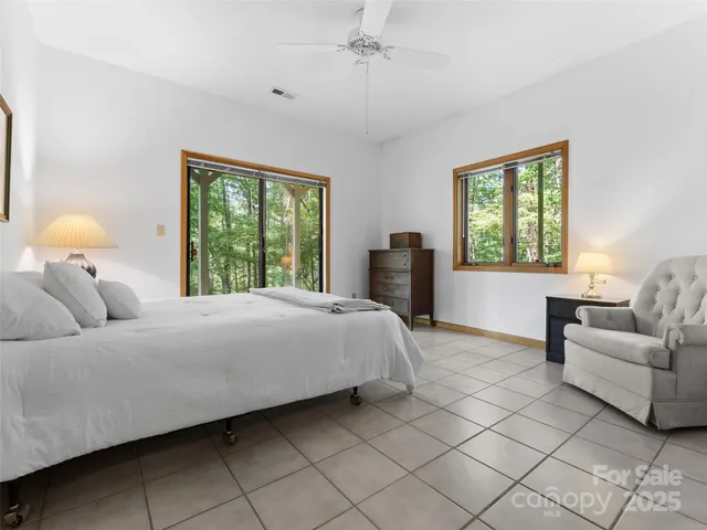 a bedroom with a bed and a couch