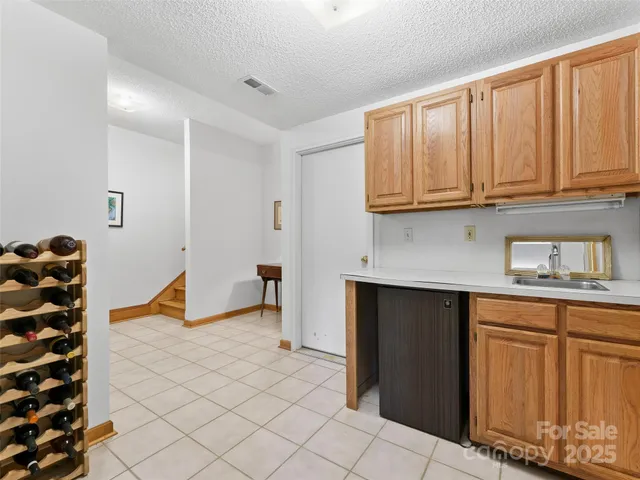 a kitchen with stainless steel appliances a stove a sink and a microwave