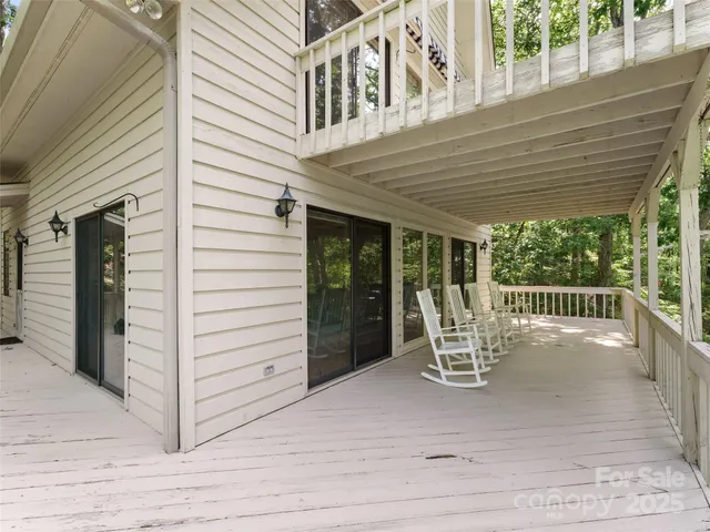 a view of a chair and table in the balcony