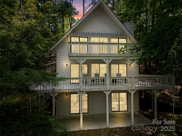 a front view of a residential apartment building with a yard