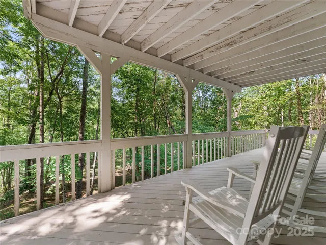 a view of balcony with furniture