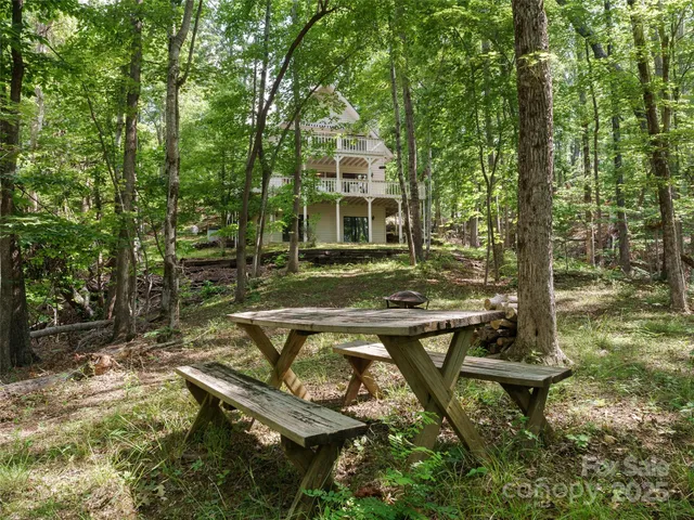 a view of a chairs in a backyard
