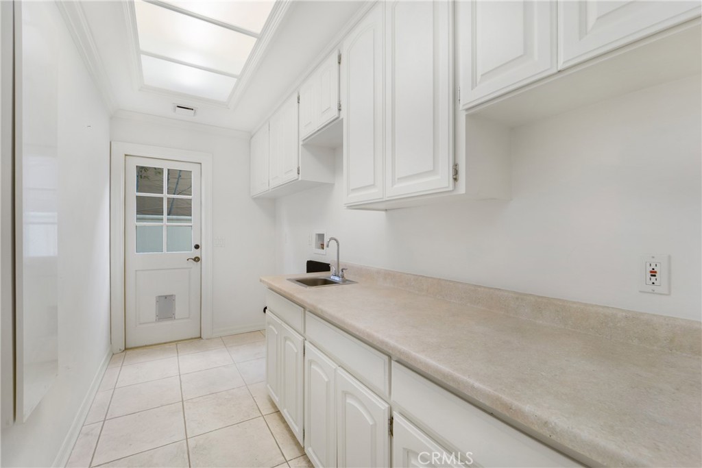 82 Ritz Cove Drive Dana Point, CA 92629 - Photo 41 of 48 a kitchen with a sink and cabinets