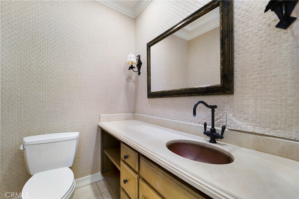 82 Ritz Cove Drive Dana Point, CA 92629 - Photo 42 of 48 a bathroom with a toilet sink and mirror