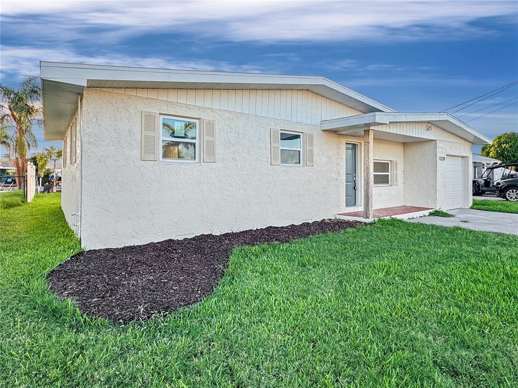 13739 Coco Avenue Hudson, FL 34667 - Photo 19 of 25 a view of an house with backyard and garden