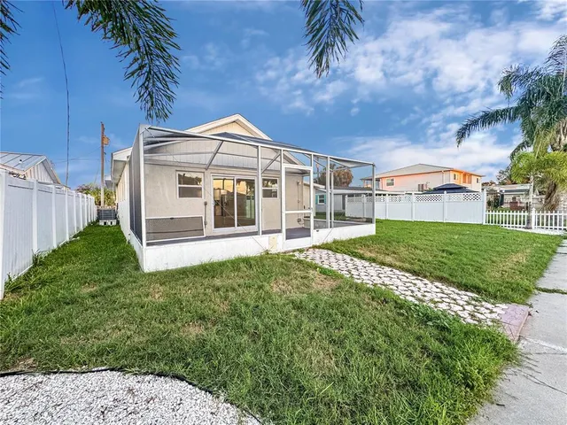 a view of a house with a backyard