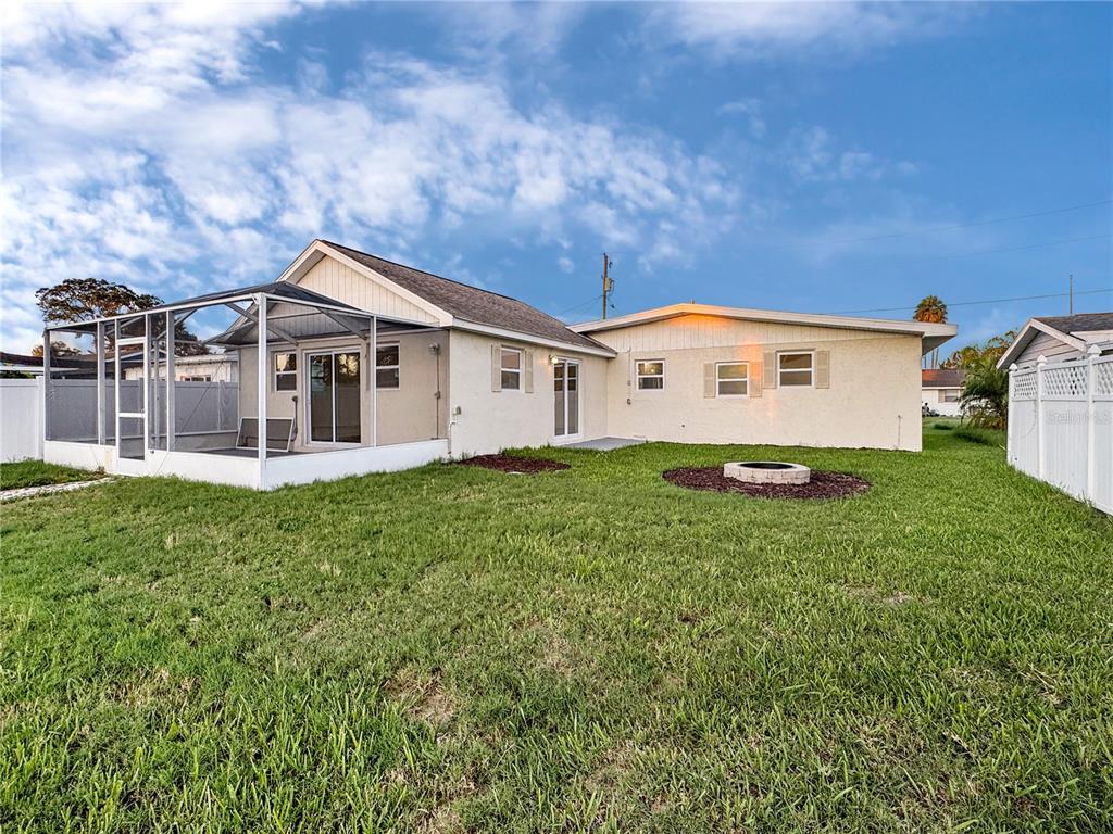 13739 Coco Avenue Hudson, FL 34667 - Photo 21 of 25 a front view of a house with garden