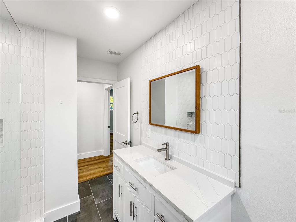 13739 Coco Avenue Hudson, FL 34667 - Photo 10 of 25 a bathroom with a sink a mirror and a toilet