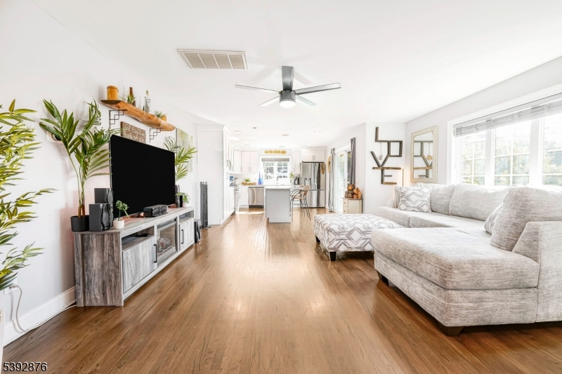 615 Prospect Avenue Fairview, NJ 07022 - Photo 3 of 18 a living room with furniture and a flat screen tv