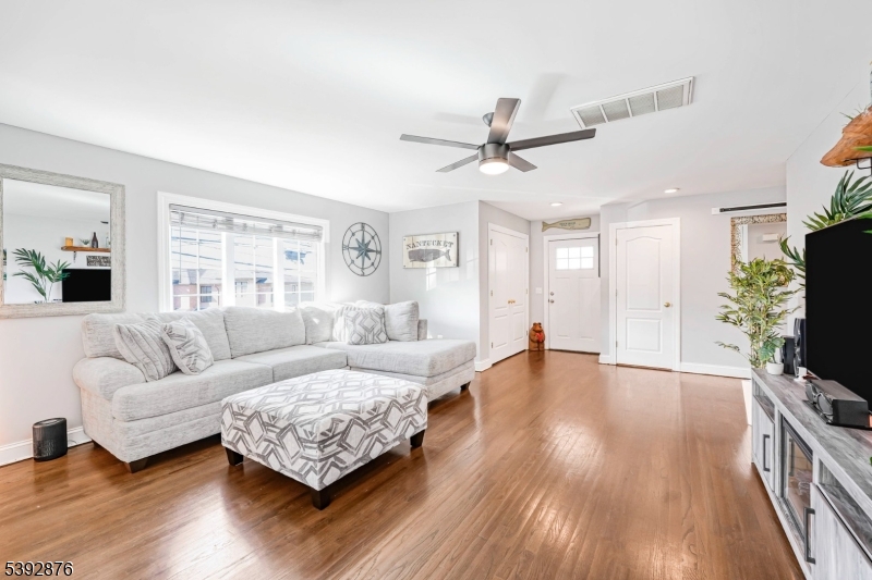 615 Prospect Avenue Fairview, NJ 07022 - Photo 4 of 18 a living room with furniture and a flat screen tv