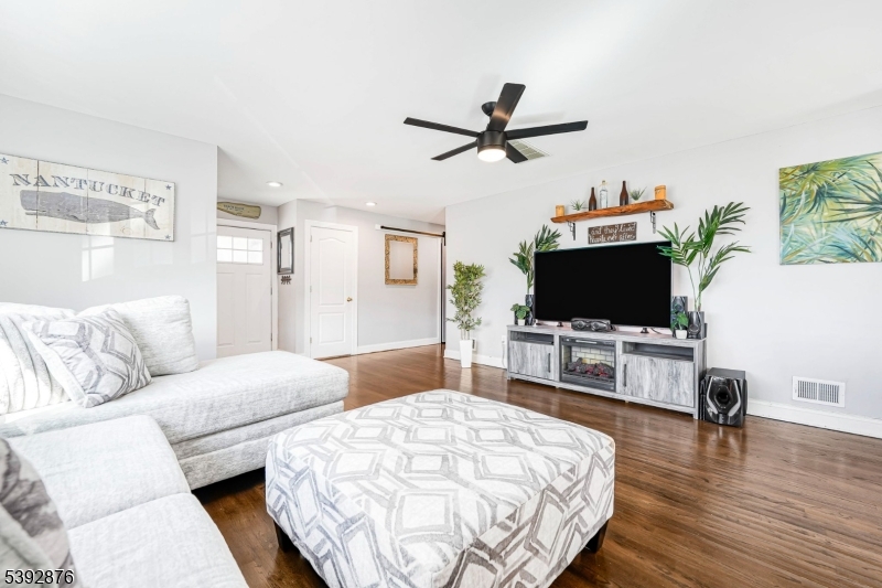 615 Prospect Avenue Fairview, NJ 07022 - Photo 5 of 18 a living room with furniture and a flat screen tv