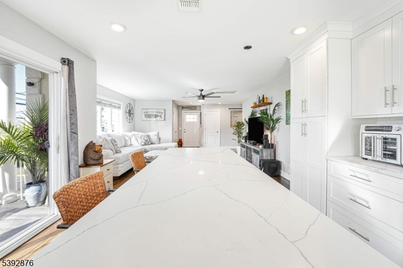 615 Prospect Avenue Fairview, NJ 07022 - Photo 8 of 18 a large white bedroom with a large bed and a large window