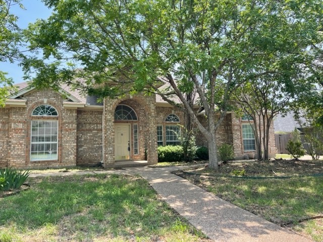 100 Lariat Trail McGregor, TX 76657 - Photo 1 of 1 front view of a house with a tree