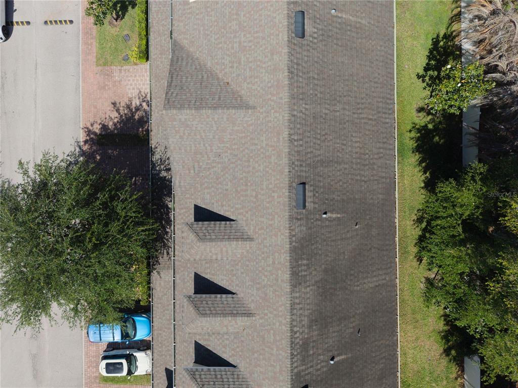 4810 Poolside Drive St. Cloud, FL 34769 - Photo 22 of 26 an aerial view of a house with a yard and potted plants
