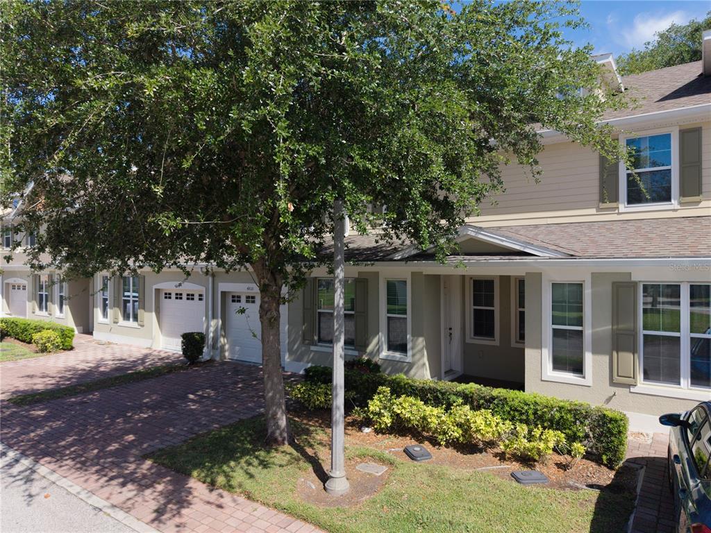 4810 Poolside Drive St. Cloud, FL 34769 - Photo 3 of 26 a front view of a house with garden