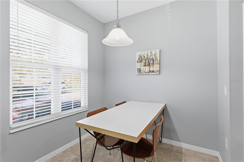 4810 Poolside Drive St. Cloud, FL 34769 - Photo 9 of 26 a view of a dining room with furniture and window