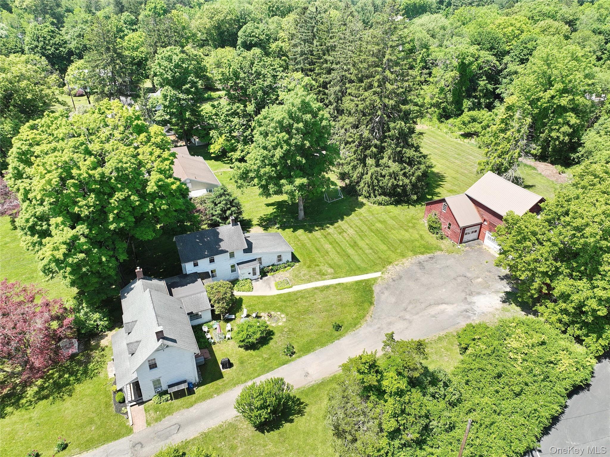 500 Haverstraw Road Suffern, NY 10901 - Photo 4 of 36 an aerial view of a house with a yard and swimming pool