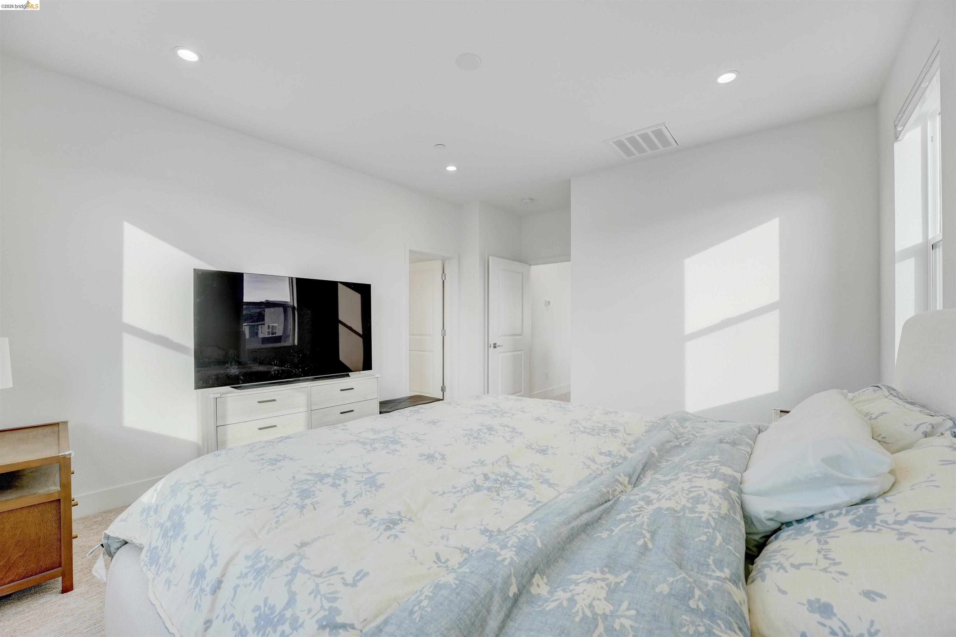 7101 Melon Court San Ramon, CA 94583 - Photo 44 of 58 a bedroom with a bed and a flat screen tv