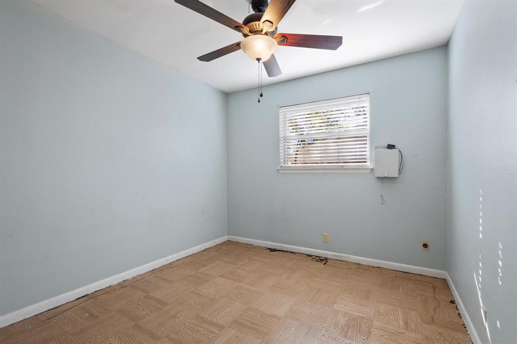1417 Morrison Drive Denison, TX 75020 - Photo 17 of 30 Spare room with ceiling fan and baseboards