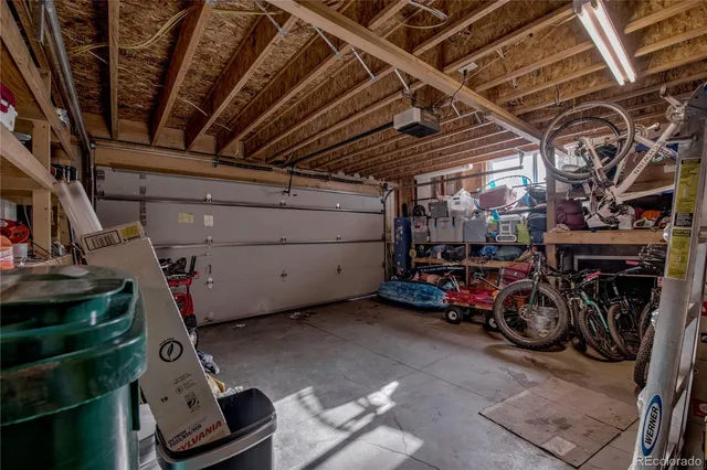 a view of parking garage with cars
