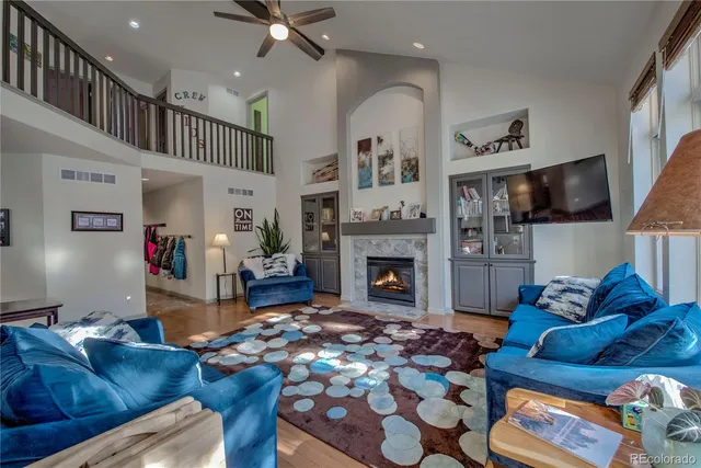 a living room with furniture and a fireplace