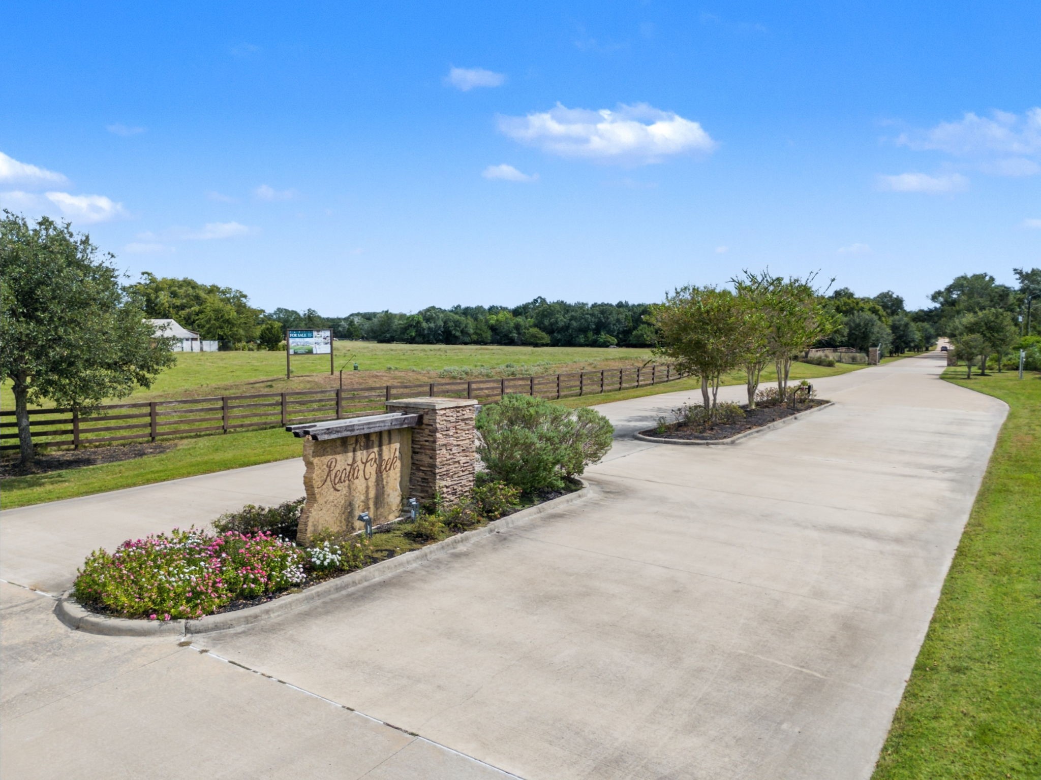405 Silverton Circle Hempstead, TX 77445 - Photo 2 of 15 a view of a lake with a garden and lake view