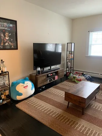 a room with furniture and a flat screen tv