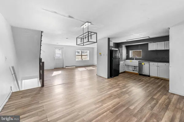a view of a kitchen from the hallway
