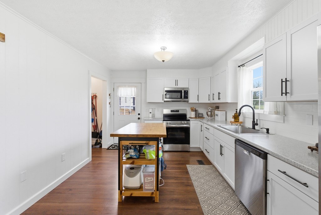 114 Viars Road Philadelphia, TN 37846 - Photo 15 of 45 a kitchen with stainless steel appliances a sink a stove a refrigerator cabinets and a window