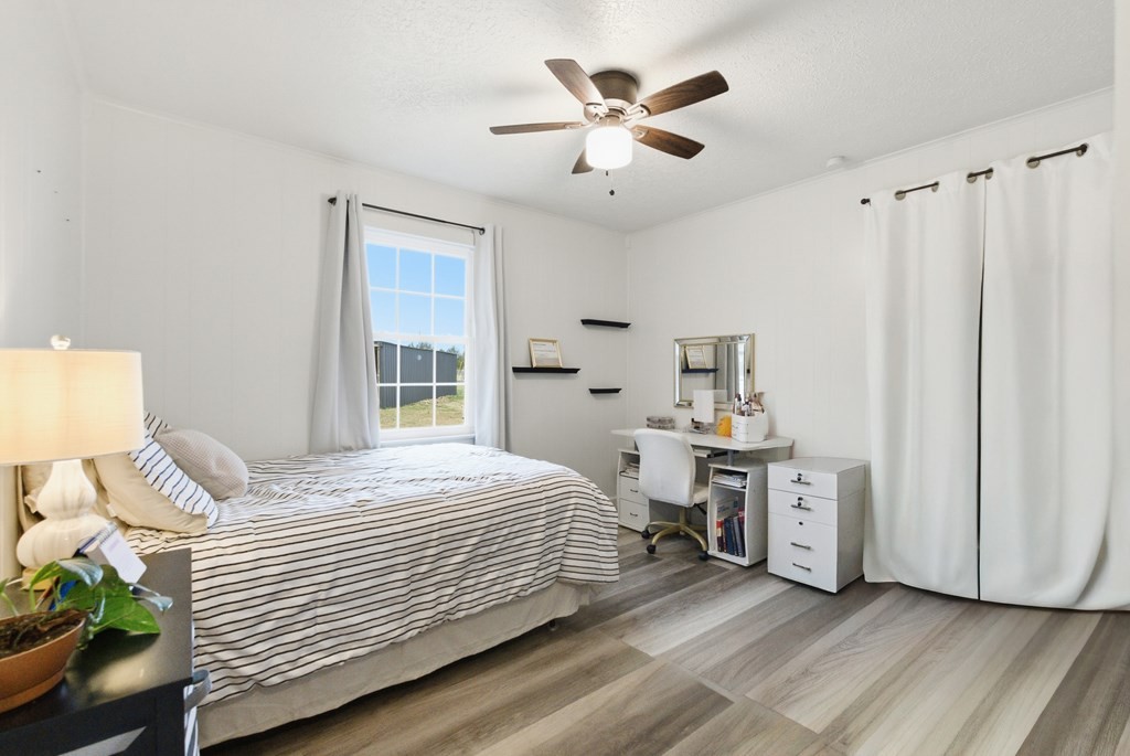 114 Viars Road Philadelphia, TN 37846 - Photo 21 of 45 a bedroom with a bed and a chandelier